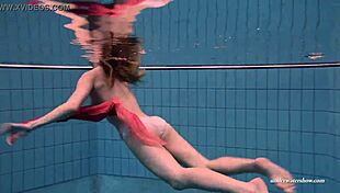 I have firm big tits in a red dress underwater.