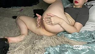 Busty amateur casually rubs her pierced pussy in a relaxed setting