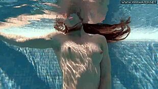 Nicole Pearl super hot and horny shaking ass in the pool with small tits