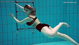 I admire Dashka's beautiful big tits in the pool