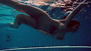 I admire Dashka's beautiful big tits in the pool