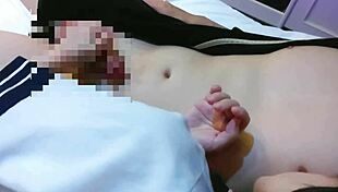 Just a cute Japanese girlfriend in a skirt getting cozy on bed