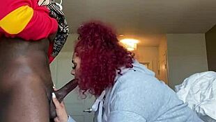 Fat redhead lady sucks big black cock from POV.