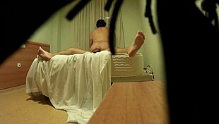 This couple gets caught in a hotel room where she licks and sucks his ass, then fingers his anus deeply.