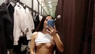 Beautiful tanned girl next door enjoys risky orgasms in public fitting room while naked