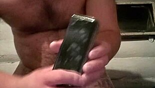 Russian gay guy fists ass with smartphone in homemade video