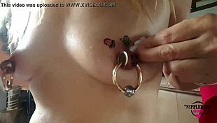 Nippleringlover horny milf sticks tattoos on huge pierced nipples close up