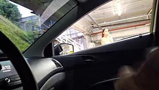 Girl in school uniform performs striptease with toy.