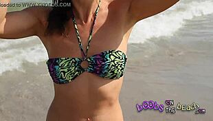 Topless sluts reveal big tits on beach