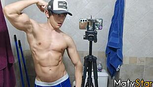 Watch me flex my muscles and cum hard in the bathroom