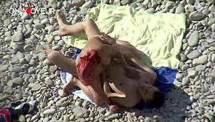 Beach voyeur, curvy milf gives head and gets it from behind in public - you watching?