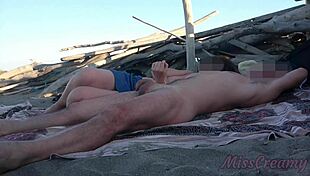 exhibitionist wife outdoor handjob on beach in front of voyeurs
