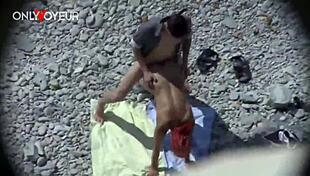 Beach voyeur, curvy milf gives head and gets it from behind in public - you watching?