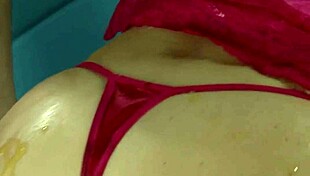 Oiled model poses in bikini