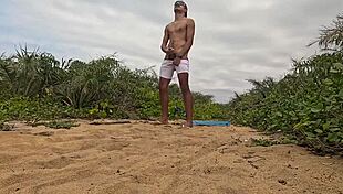 african guy jerks off and cums on the beach