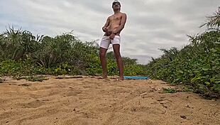 african guy jerks off and cums on the beach