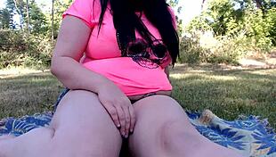 Showing off a fat belly outdoors in public with daring confidence