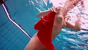 Avenna swims nude in the pool, her tight pussy exposed