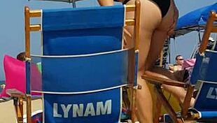 Check out this candid shot of the little slut's ass in bikini at the beach.