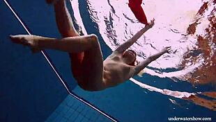 Avenna swims nude in the pool, her tight pussy exposed