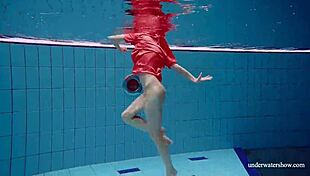 Avenna swims nude in the pool, her tight pussy exposed