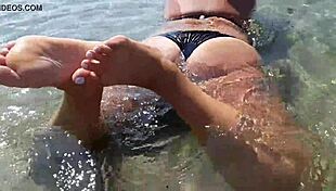 milf with wet big boobs sucks on a toy during outdoor public massage session