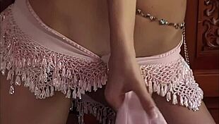 teen temptation busty brunette katie fey poses topless by the door