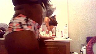 a young girl dances in the bathroom to thug music