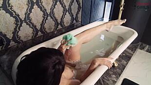 lady snow teases in solo bath scene with wet brunette body and golden shower finale