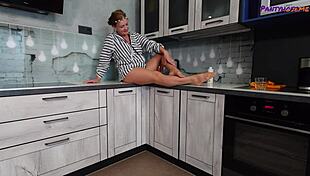 mature redhead iris shows legs and feet in tan pantyhose.