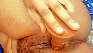 Hairy lesbian fingers her narrow ass, masturbates, and squirts in solo anal play.