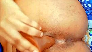 Hairy lesbian fingers her narrow ass, masturbates, and squirts in solo anal play.