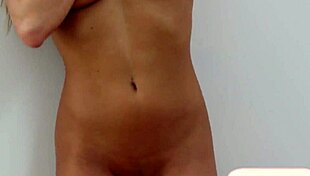 Hot Blonde Playboy Babe Strips with Shaved Pussy in Bedroom