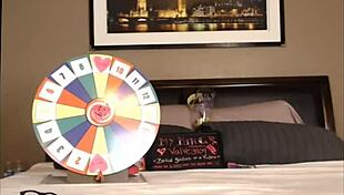 Emily plays wheel of fortune, showing her sexy tits on webcam