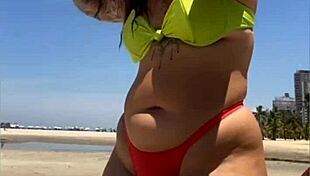 hey babe, check out this casada flashing her bikini stuffed tight at the beach!
