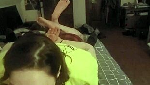 This redhead slut lays on her belly, deepthroating like a submissive slave