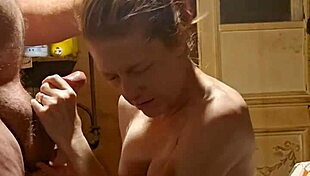 Redhead engages in foreplay with ball licking, handjob, and deepthroat leading to cum