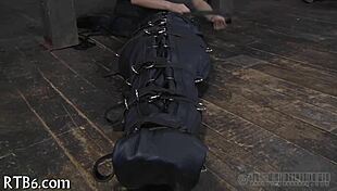 hey, this restrained girl is getting punished hard in the garage