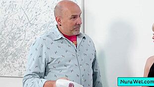 In this nuru massage, the sexy blonde Lilly Bell pours gel on her naked body and rubs her natural tits against client Codey Steele.