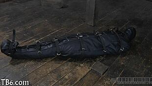 hey, this restrained girl is getting punished hard in the garage