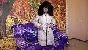 Milf in a down coat in a hood with fur trim sucks a big dildo?