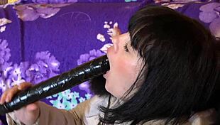 Milf in a down coat in a hood with fur trim sucks a big dildo?