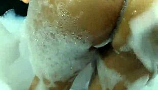 Are you watching this hot brunette masturbating and orgasming on a giant dildo in the bathtub