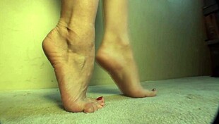 I watch McKenzie arch and lick her feet in sexy solo masturbation.