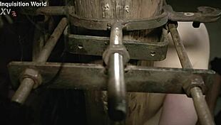 Tormented whore Judith is restrained on the interrogation chair with screw clamps on her tits and an iron hook in her cunt