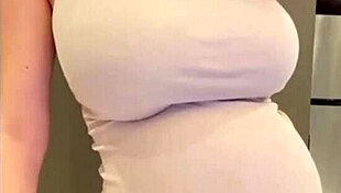 My stepmom flaunts her elastic ass and huge milky tits while I watch in awe. She teases with every move.