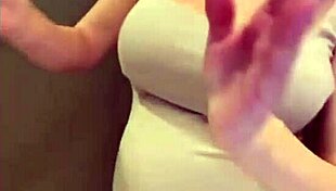 My stepmom flaunts her elastic ass and huge milky tits while I watch in awe. She teases with every move.