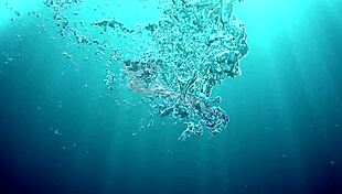 Irina russaka bathes underwater in the pool as a petite shaved teen