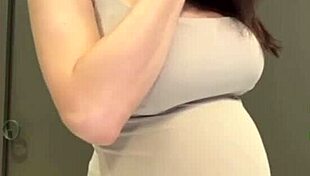 My stepmom flaunts her elastic ass and huge milky tits while I watch in awe. She teases with every move.