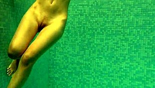 Irina russaka bathes underwater in the pool as a petite shaved teen